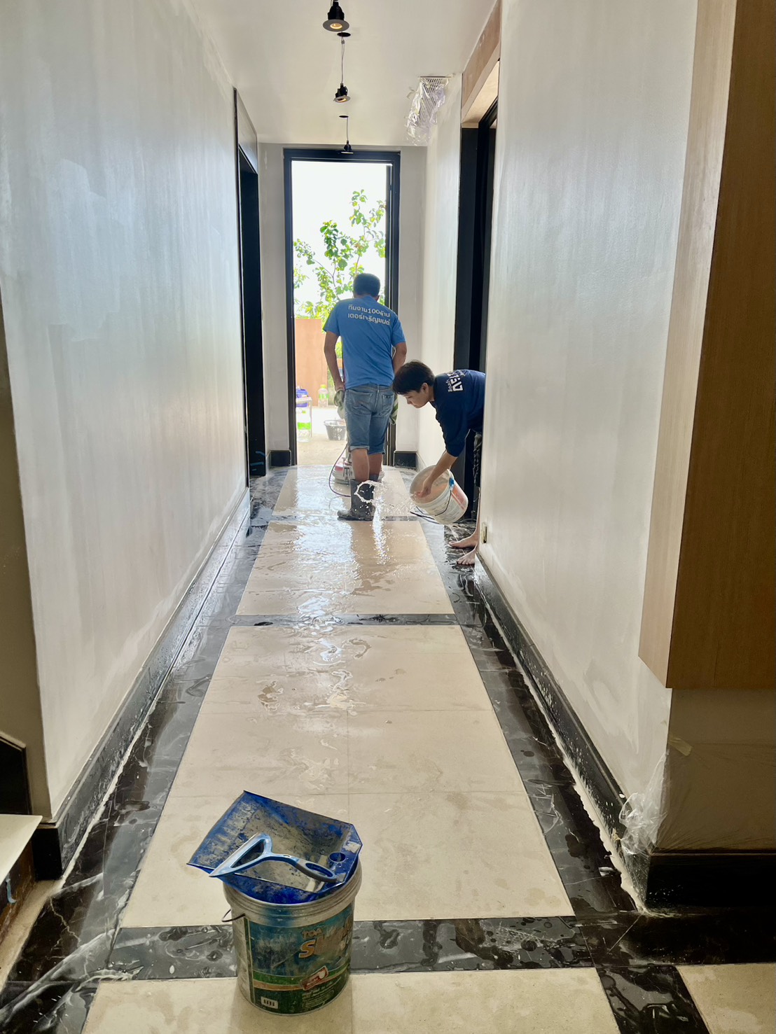 Machine repolishing marble floor corridor Conrad Koh Samui Thailand restoration team